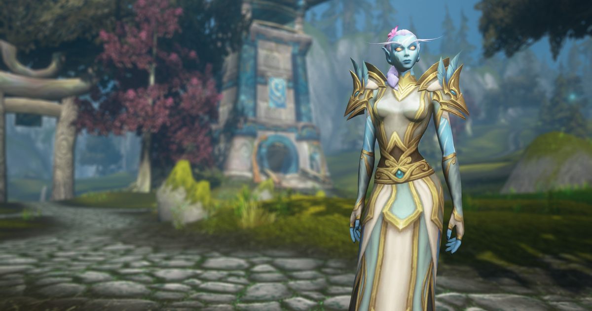 A Skyborne elf in white and gold robes standing before a blossoming tree and a stone monument